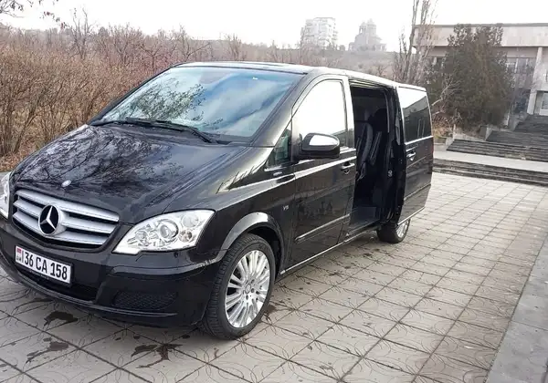 Black Mercedes-Benz Viano with its sliding door open